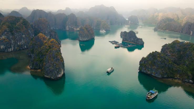 Limestone karsts and boats on Lan Ha Bay
