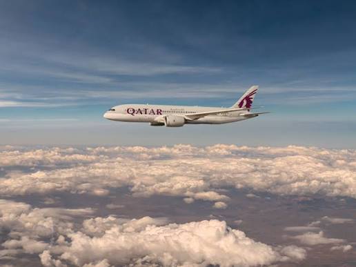 Qatar Airways Dreamliner above the clouds